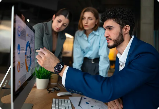 people in office checking graphs